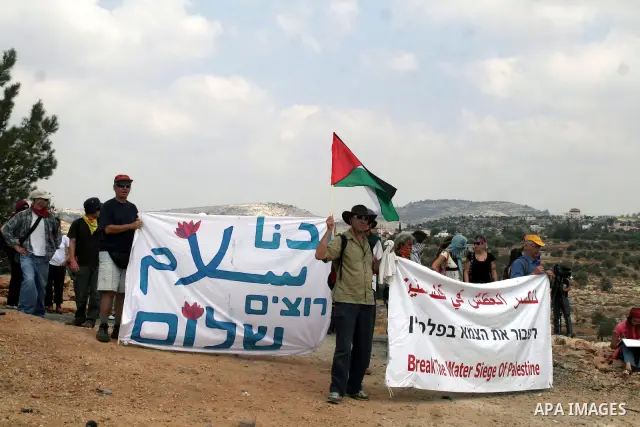 Palestinian and foreign protestors during a demonstration against Israel's controversial separation barrier in the West Bank village of Bilin near Ramallah on Sep 4, 2009.. Photo by Nedal Shtieh