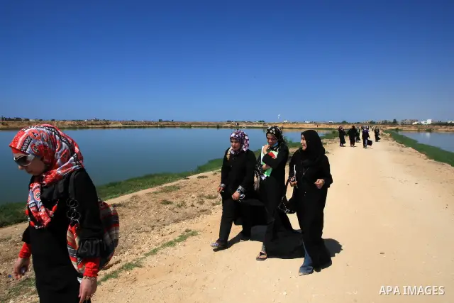 Palestinian university students visit sewage ponds in northern Gaza Strip as part of their practical study. The World Bank said its projects to resolve the wastewater crisis in Gaza are delayed due to an Israeli blockade...