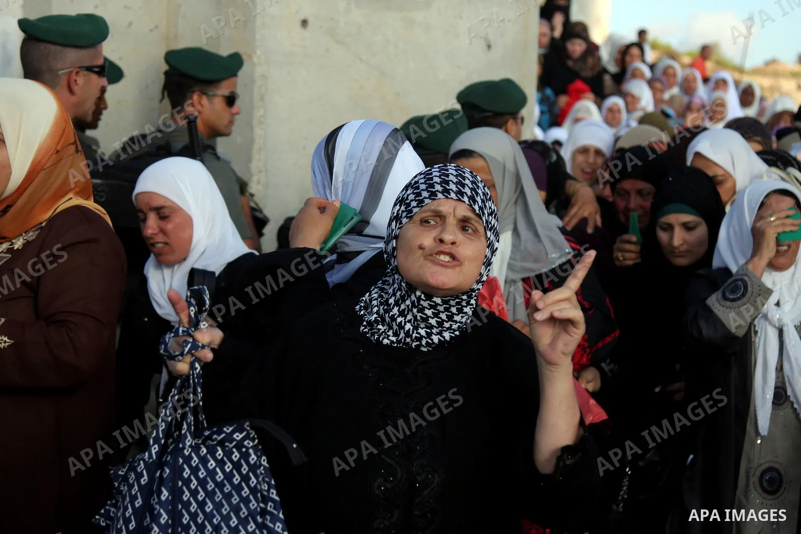 Palestinian women wait to pass at the Qalandiya checkpoint outside the West Bank city of Ramallah on Sep 11,2009 .to attend prayers in the Al-Aqsa Mosque compound in Jerusalem, Friday Sep11, 2009, the third Friday of the...