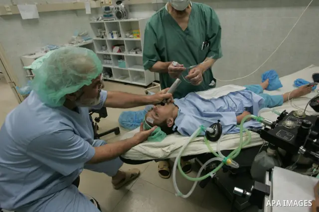 Palestinian medical team performs surgery operations to the eyes of children in San John hospital in Gaza City on Sep 13,2009.Israel's blockade on Gaza doesn't allow citizens from traveling to abroad for treatment. Photo...