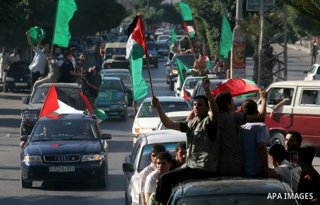 Palestinians celebrate the anticipated release of prisoners currently held in Israel, in Gaza city, Wednesday, Sep 30, 2009. Israel will release 20 Palestinian women from prison this week in exchange for a videotape prov...