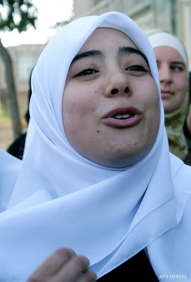 Hamas supporter Hiba al-Natsheh talks during the following her release from an Israeli prison on October 02, 2009 in the West Bank city of Hebron. Israel received footage showing soldier Gilad Shalit looking lucid and he...