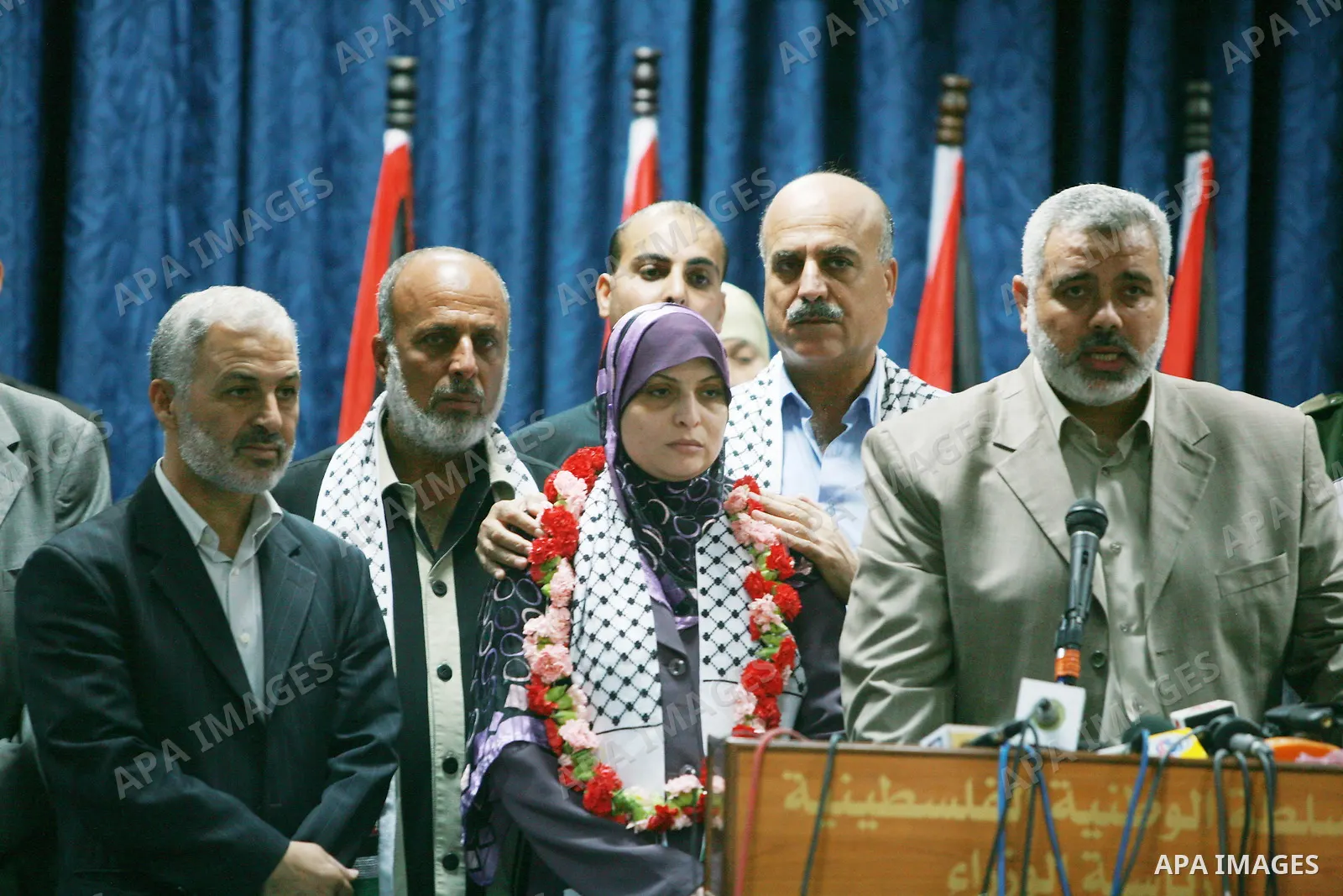 Palestinian Prime Minister of Hamas Ismail Haniya (1R) greets Roudah Habib (3L) , the final Palestinian woman prisoner set free by Israel as part of a breakthrough swap with the Hamas movement for a video of its soldier...
