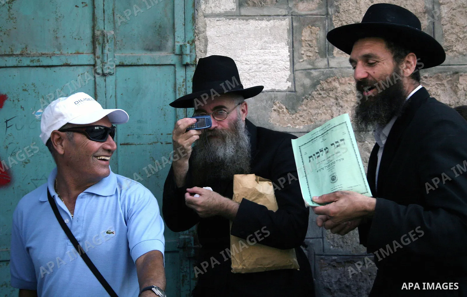 Jewish settlers as they walk in the West Bank city of Hebron October 4, 2009.Photo by Najeh Hashlamoun