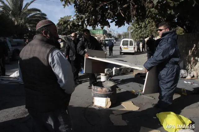 A Jewish settlers carry a box with belongings of a Palestinian family into a tent after they took over the family's house in the Arab east Jerusalem neighborhood of Sheikh Jarrah on December 02, 2009. photo by Muammar Aw...