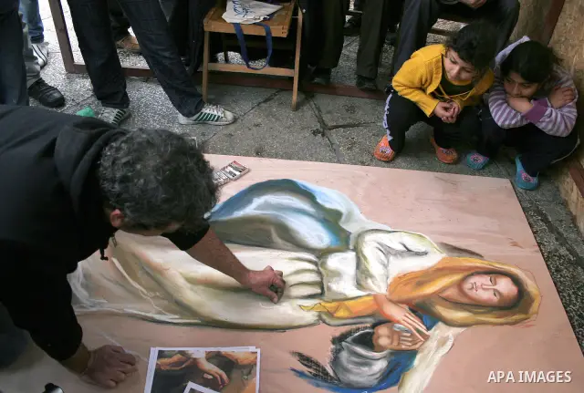 An Italian artist from the Madonnari Neapolitan School works on a sculpture outside the Church of the Nativity in the biblical West Bank city of Bethlehem on December 8, 2009. The traditional birthplace of Jesus Christ i...