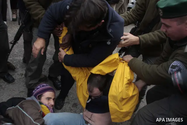 Israeli police arrest demonstrators during a demonstration against Jewish settlements and in solidarity with Palestinian families who were evicted from their homes in the Sheikh Jarrah neighbourhood of East Jerusalem Dec...
