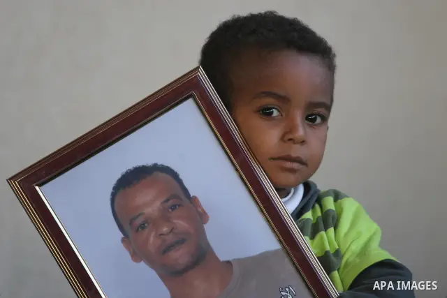 Palestinians hold pictures of their relatives jailed in Israeli prisons during a weekly protest in Gaza City on Dec 28, 2009 to call for their release. Currently Israel is holding 11,000 Palestinians in its jails. Photo...