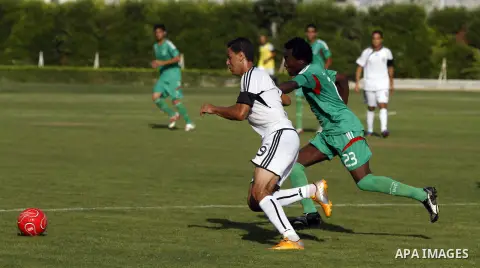 Palestinian soccer team from al-Shijia Union club compete against Gaza Sports club in Gaza City on Sept. 14, 2013. The match ended in 1-1 draw. Photo by Alaa Shamaly