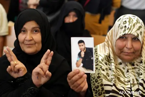 Palestinian women take part in a protest demanding the release of all Palestinian prisoners held in Israeli jails,in front of the Red Cross office in Gaza City on Nov. 04, 2013. Photo by Mohammed Asad