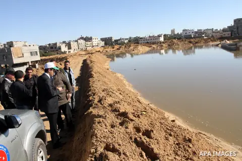 Kursad Mahmat, the Coordinator of the Turkish Cooperation and Development Agency TIKA, inspects the sewage water pumps at al-Sheikh Redwan neighborhood, in Gaza City on Dec. 24, 2013. Photo by Mohammed Asad