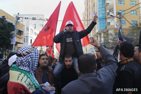 Supporters of the Palestinian Democratic Front celebrate the release of Palestinian prisoner Samer al-Issawi in Gaza city on December 25, 2013. Israel freed al-Issawi from jail on Monday, completing a deal agreed earlier...