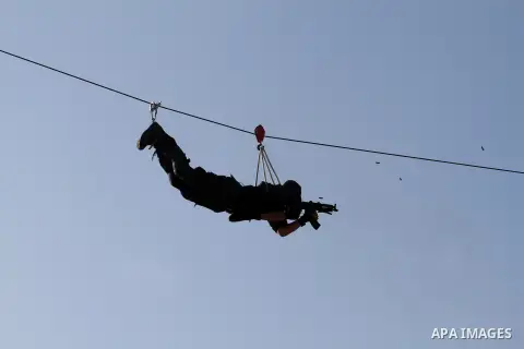Palestinian of the members of the Security and Protection show their skills during a graduation ceremony in Gaza City on Jan. 02, 2014. Photo by Mohammed Asad