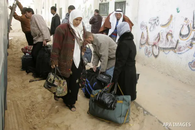 Palestinians prepare to travel to Egypt through the Rafah border crossing in the southern Gaza Strip, in Gaza city on January 3, 2010. Israel has sealed Gaza off from all but vital humanitarian aid and has strictly limit...