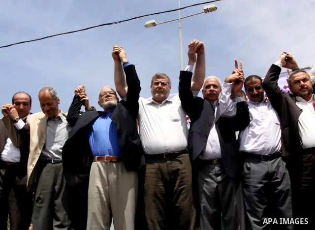 Palestinians take part in a protest near Erez crossing between Israel and the northern Gaza Strip April 21, 2010, against orders introduced by the Israeli military that human rights activists said last week could make al...