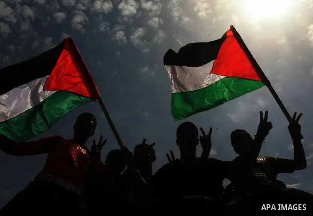Palestinians take part in a protest near Erez crossing between Israel and the northern Gaza Strip April 21, 2010, against orders introduced by the Israeli military that human rights activists said last week could make al...