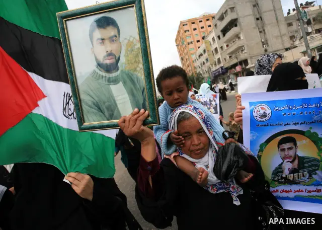 Palestinian Hamas supporters take part in a protest in Gaza City April 22, 2010, calling for the release of Palestinian prisoners from Israeli jails. According to Waed, the Palestinian Prisoners Association, about 7,500...