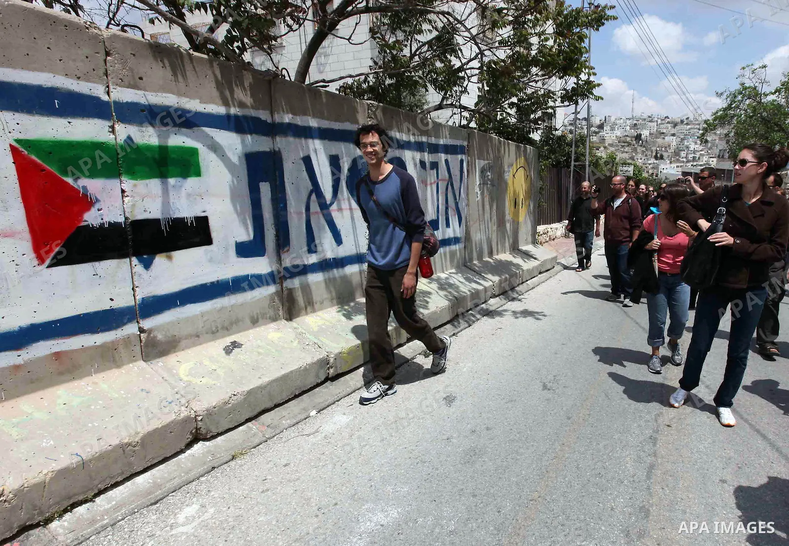 A group of left-wing Israelis visit Palestinian families living close to Jewish settlers in the divided West Bank city of Hebron on April 23,2010. Photo by Najeh Hashlamoun .