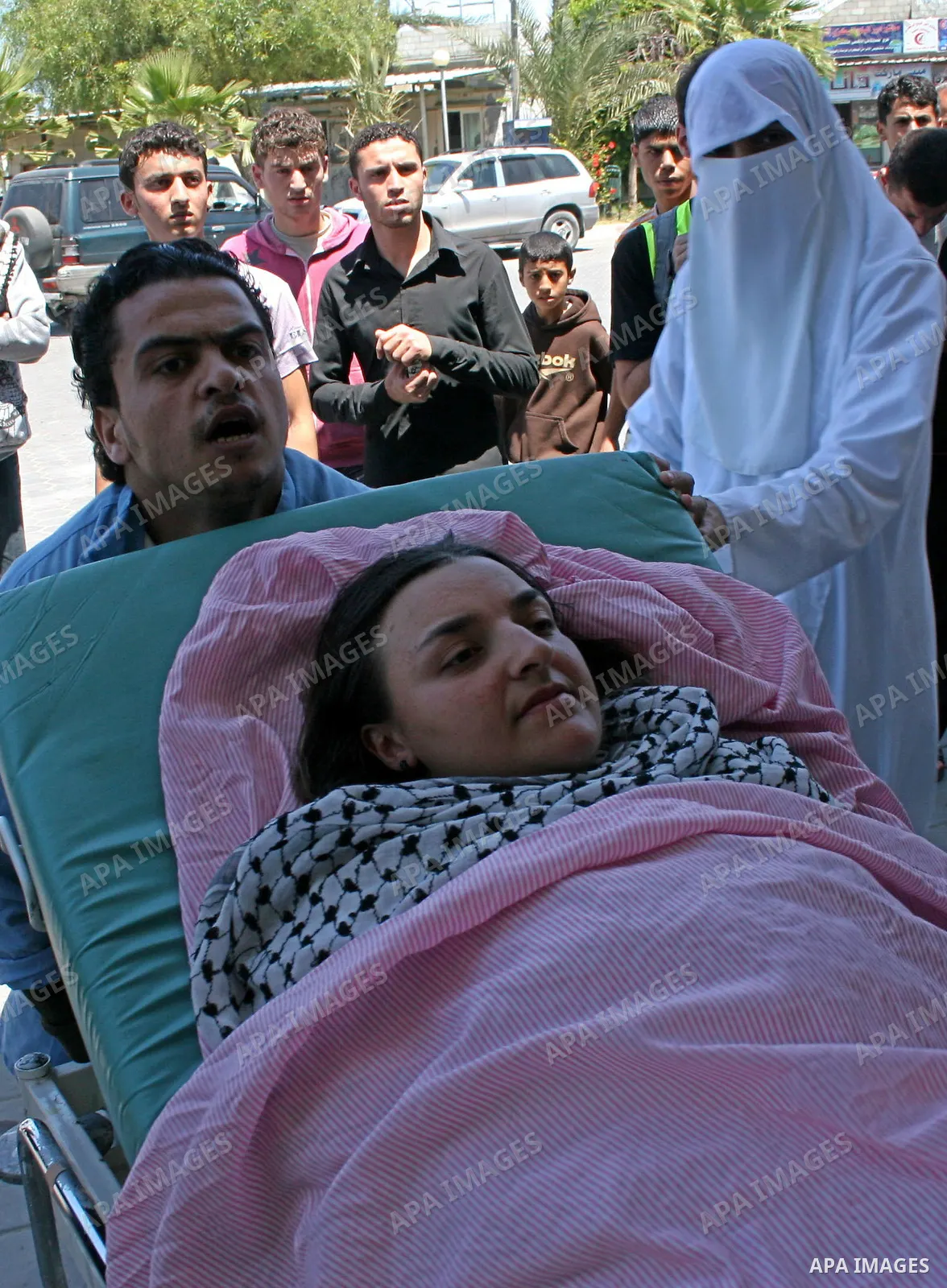 Bianca Zammit, 28, a pro-Palestinian activist from Malta, is transported into the Al-Aqsa hospital, after being injured during a protest calling for an end to the blockade of Gaza, near the Al-Maghazi refugee camp, in De...