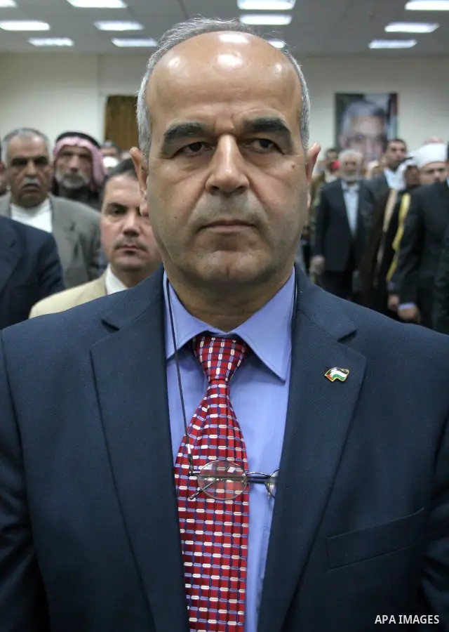 A Palestinian Hebron Governor, Sameer Abu Znayd takes part in a ceremony honoring the chief of the general personnel council, Hussein al-Arja, in the building of Hebron governorate in the West Bank city of Hebron on May...