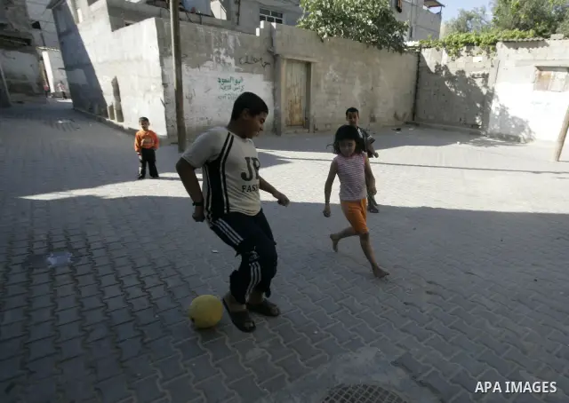 Palestinian children play in the street in the Rafah refugee camp in southern Gaza Strip on May 5, 2010. Palestinians mark the 15 of May every year as Nakba day, or the creation of the state of Israel in May 1948, that l...