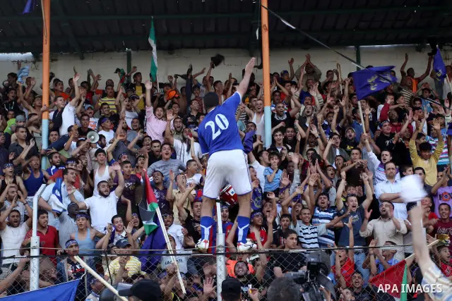 Palestinian player of France celebrates after the winning in a soccer match with Jordan during the final match of Gaza's version of the World Cup in Gaza City on May 15,2010. The Gaza Strip kicked off its own version of...