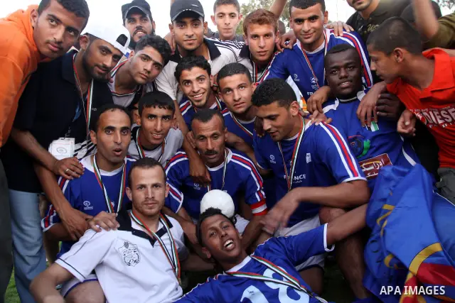 Palestinian players of France celebrate after the winning in a soccer match with Jordan during the final match of Gaza's version of the World Cup in Gaza City on May 15,2010. The Gaza Strip kicked off its own version of...