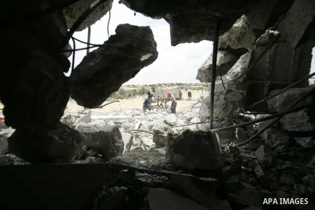 Palestinians inspect their belongings after their house was demolished by Hamas security forces in Rafah in the southern Gaza Strip on May 19, 2010. Hamas Islamists ruling the Gaza Strip have been demolishing Palestinian...