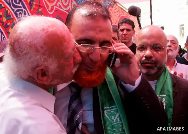 Palestinian Hamas lawmaker Mohammed Abu Tir is greeted after his release from Israeli prison, at his house in the village of Tsur Baher, in East Jerusalem May 20, 2010. Abu Tir was arrested following abducted Israeli sol...