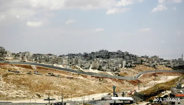 A General view of the Israeli separation barrier surrounding the village of Anata in the East Jerusalem on May 24, 2010. Photo by Mahfuz Abu Turk