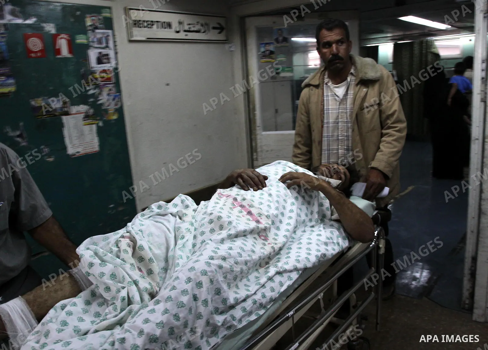 A Palestinian man receives treatment at Al-Shefa'a hospital after he injured by An Israeli tank shell explosion in Gaza city on May 27, 2010.Two Palestinian farmers were wounded when an Israeli tank shell exploded near t...
