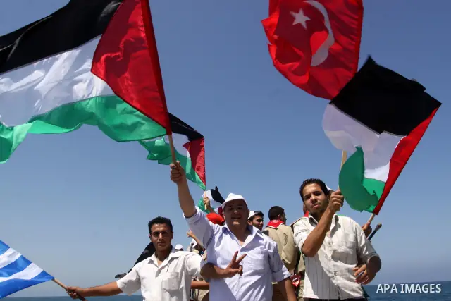 Palestinians ride boats and wave flags of various countries in a preparation ceremony to receive the international aid convoy ''Freedom Flotilla'' in Gaza Seaport, on May 30, 2010. The organizers of the ''Freedom Flotill...
