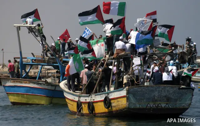 Palestinians ride boats in a preparation ceremony to receive the international aid convoy ''Freedom Flotilla'' in Gaza Seaport, on May 30, 2010. The organizers of the ''Freedom Flotilla'' said the ships set out from Cypr...