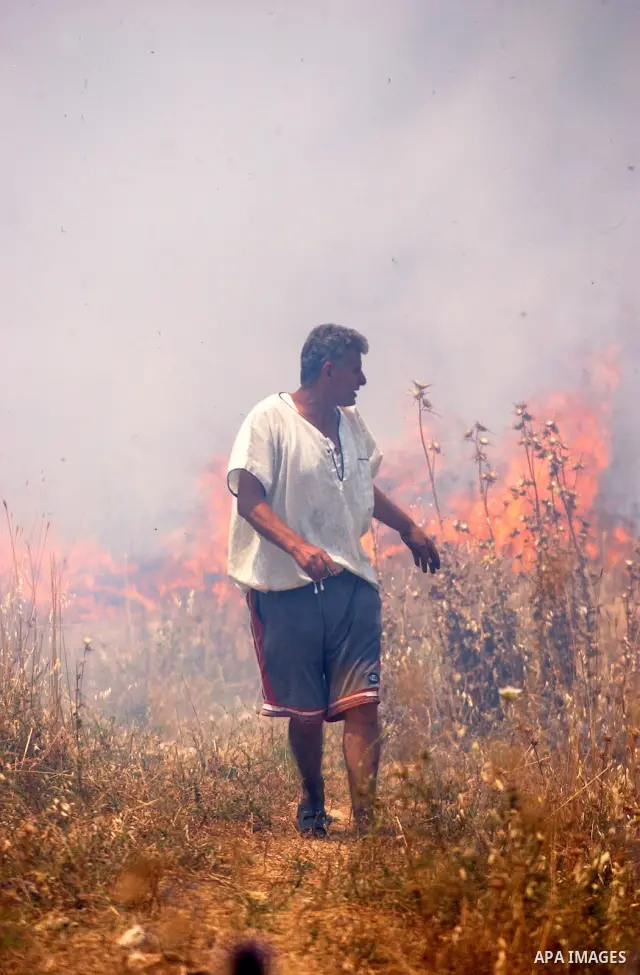 A Palestinian villager tries to put out fires after fields were set ablaze in the village of Asira al-Qiblyia in the northern West Bank on June 2, 2010. According to Palestinian villagers, Jewish settlers from the nearby...