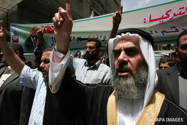 Palestinian Hamas leaders take part in a demonstration against the Israeli naval commando raid on a flotilla attempting to break the blockade on Gaza, after Friday prayer at Nuseirat refugee camp in central Gaza Strip, F...