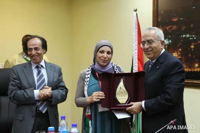Palestinian Prime Minister Salam Fayyad meets with the third Palestinian delegation of the forum of culture and education in the West Bank city of Ramallah on June 9, 2010. Photo by Mustafa Abu Dayeh\pool