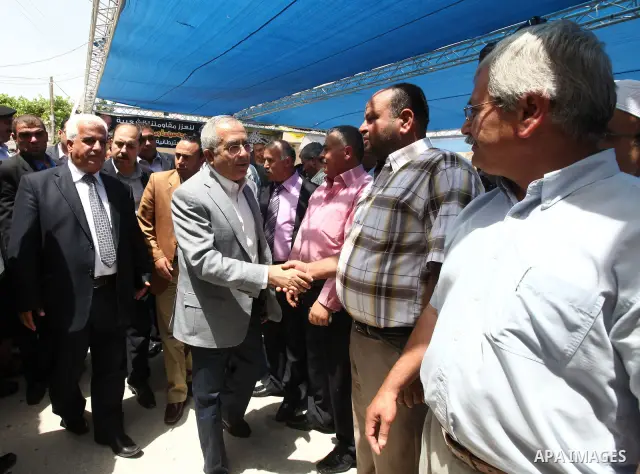 Palestinian Prime Minister Salam Fayyad takes part in Friday prayer at a mosque after its been under renovations since fire was set to it in the beginning of April at the West Bank village of Luba a-Sharkiyeh near the We...