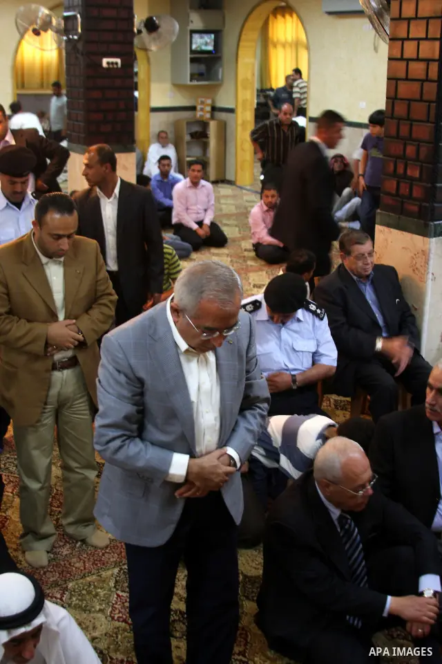 Palestinian Prime Minister Salam Fayyad takes part in Friday prayer at a mosque after its been under renovations since fire was set to it in the beginning of April at the West Bank village of Luba a-Sharkiyeh near the We...