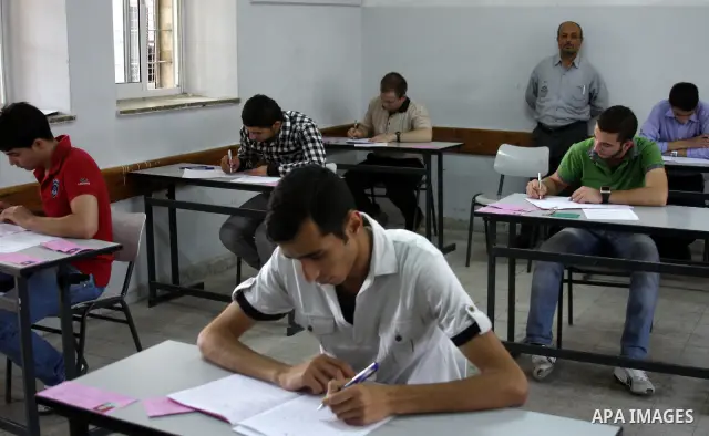 Students on the first day of the General Secondary Exams in Palestine School in the West Bank city of Hebron on June 12, 2010. Photo by Mamoun Wazwaz