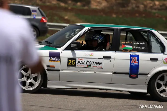 A Palestinian driver woman competes in an auto rally on the outskirts of the West Bank city of Ramallah on June 12, 2010, in which the British consulate in Jerusalem has sponsored eight Palestinian women drivers. Photo b...