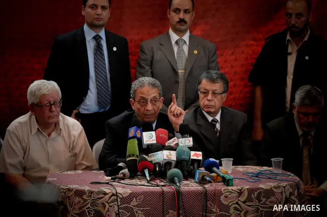 Arab League Secretary General Amr Moussa of Egypt talks to Palestinians while visiting a United Nations school, damaged during the offensive Israel launched in late 2008-early 2009, in Beit Lahiya, northern Gaza Strip, S...