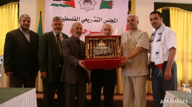 The spokesman of the Palestinian Parliament, Ahmed Bahr honors the Algerian delegation members in Gaza, June 14, 2010. The Algerian delegation entered Gaza on Saturday during a visit to Gaza which has been under the Isra...