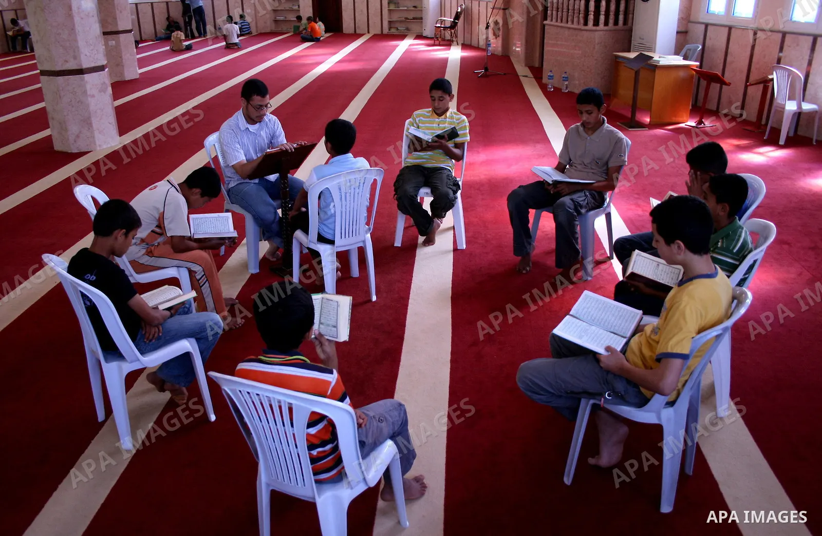 Palestinian boys study the holy Koran during a memorization program supported by the Islamist movement Hamas in Gaza City on June 15, 2010. Photo by Mustafa Alashqar