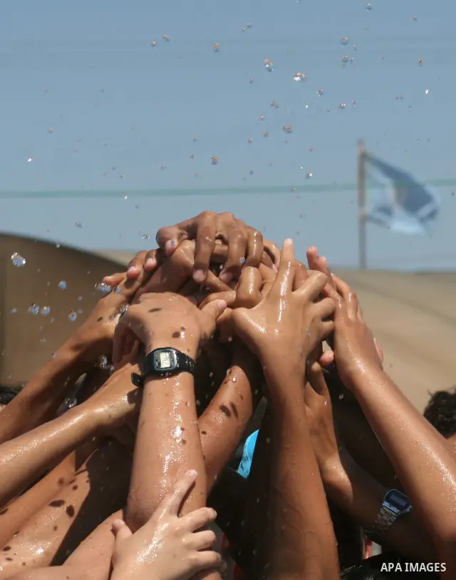 Palestinian boys enjoy at a summer camp run by the United Nations Relief and Works Agency, (UNRWA), on the beach in Gaza City, June 15, 2010. UNRWA has prepared 38 beach locations and 86 schools for its program entitled...