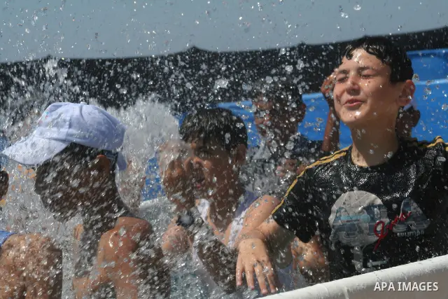Palestinian boys enjoy at a summer camp run by the United Nations Relief and Works Agency, (UNRWA), on the beach in Gaza City, June 15, 2010. UNRWA has prepared 38 beach locations and 86 schools for its program entitled...