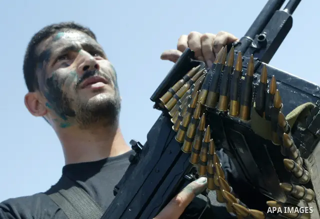 Members of Hamas' security forces demonstrate their skills during a graduation ceremony in Gaza City June 17, 2010. Photo by Ashraf Amra