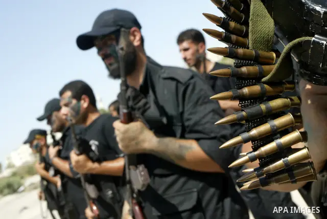 Members of Hamas' security forces demonstrate their skills during a graduation ceremony in Gaza City June 17, 2010. Photo by Ashraf Amra