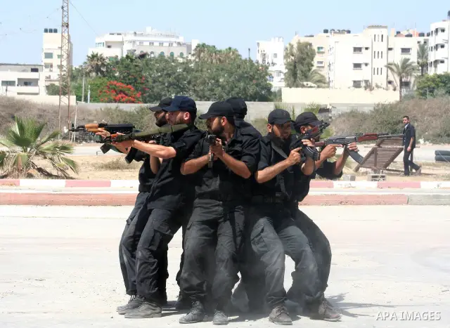 Members of Hamas' security forces demonstrate their skills during a graduation ceremony in Gaza City June 17, 2010. Photo by Ashraf Amra