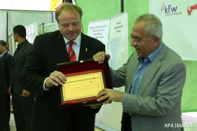 Palestinian Prime Minister Salam Fayyad with the German Minister of Economic Cooperation and Development, Dirk Nipple, Launch Project starch wastewater plant in the West Bank city of Nablus on June 19, 2010. Photo by Wag...