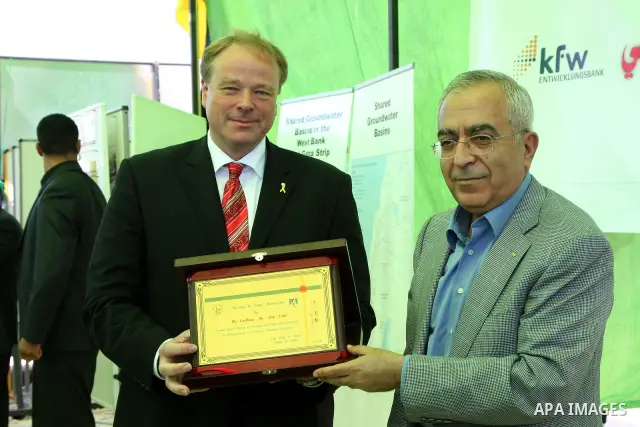 Palestinian Prime Minister Salam Fayyad with the German Minister of Economic Cooperation and Development, Dirk Nipple, Launch Project starch wastewater plant in the West Bank city of Nablus on June 19, 2010. Photo by Wag...